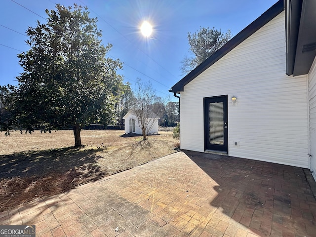 view of patio with a storage unit