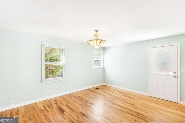 spare room featuring hardwood / wood-style floors