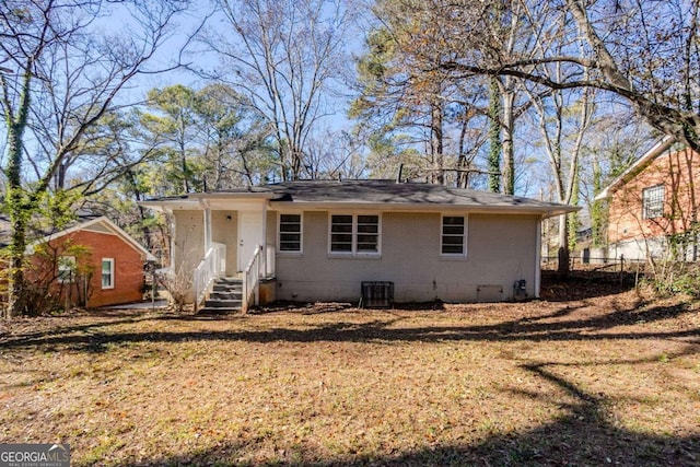 rear view of house with cooling unit