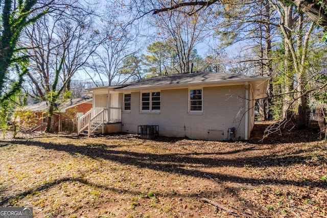 rear view of property featuring central air condition unit