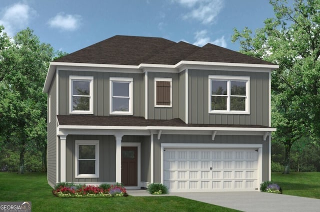 view of front facade featuring a front yard and a garage