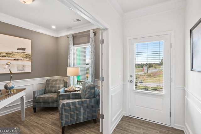 sitting room featuring plenty of natural light, dark hardwood / wood-style floors, and crown molding