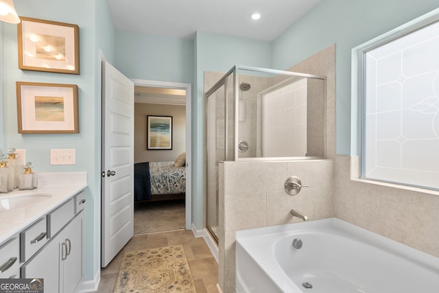 bathroom featuring tile patterned flooring, vanity, and independent shower and bath