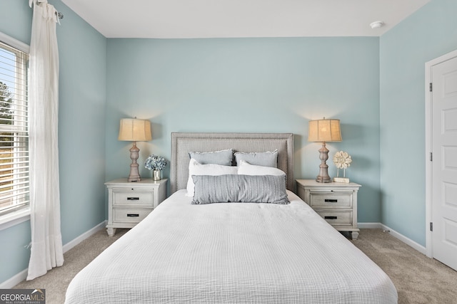 bedroom with light colored carpet