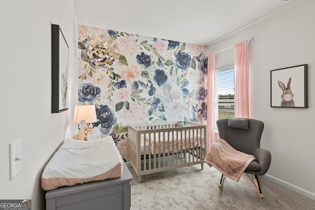 carpeted bedroom with a nursery area