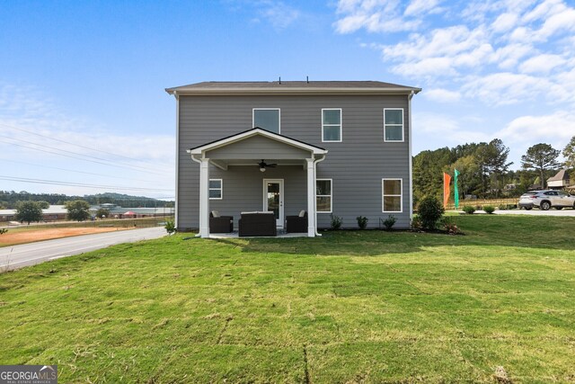 view of front facade featuring a front lawn, an outdoor hangout area, and ceiling fan