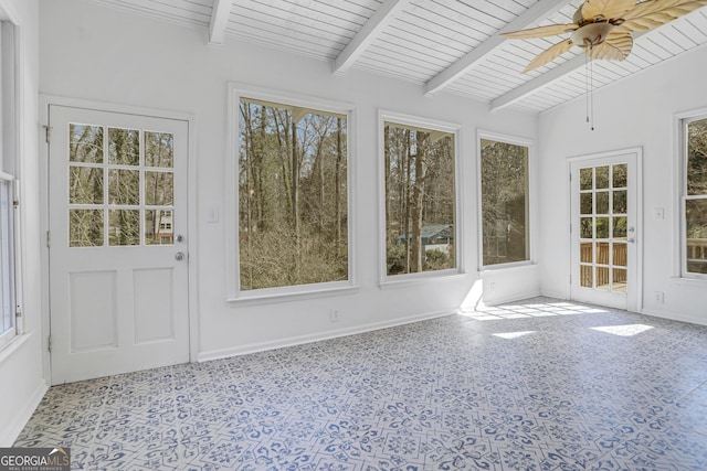 unfurnished sunroom featuring lofted ceiling with beams, ceiling fan, and wood ceiling