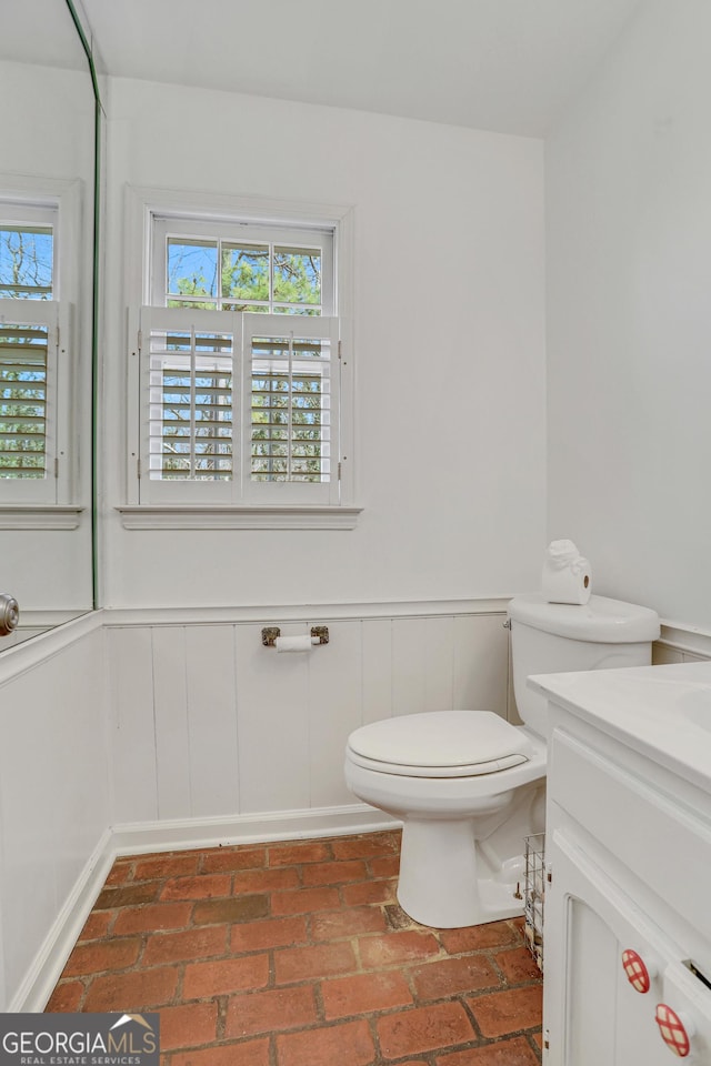 bathroom featuring toilet and vanity