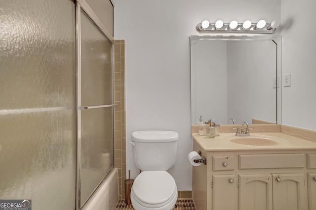 full bathroom featuring toilet, vanity, and shower / bath combination with glass door