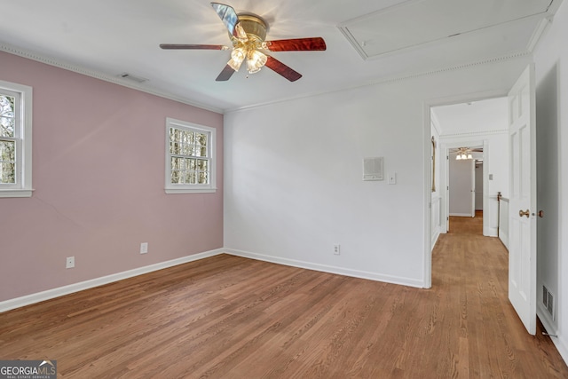 unfurnished bedroom with ceiling fan, crown molding, and light hardwood / wood-style floors