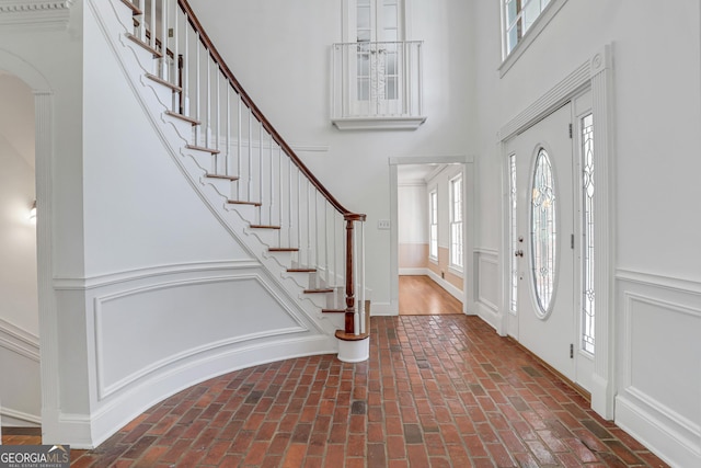 foyer with a towering ceiling