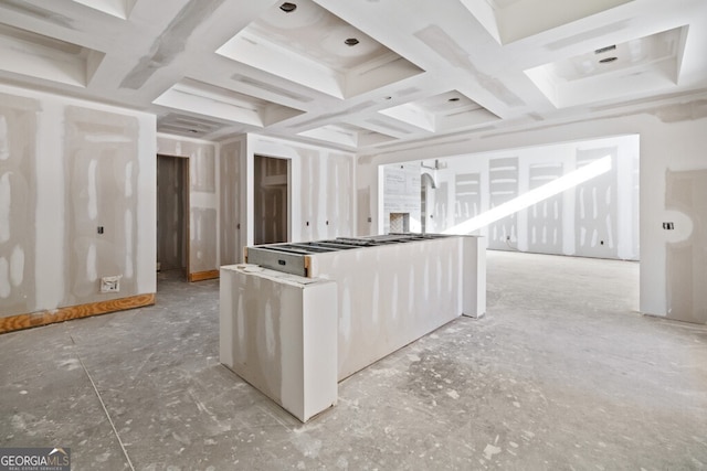 kitchen featuring white cabinetry and coffered ceiling