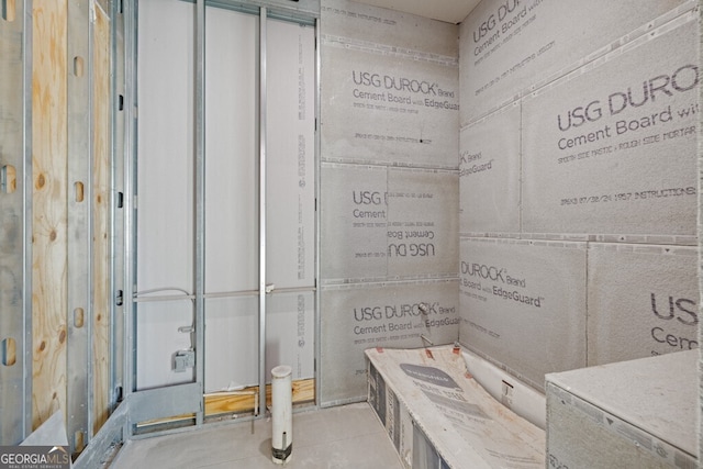 bathroom with tile patterned floors