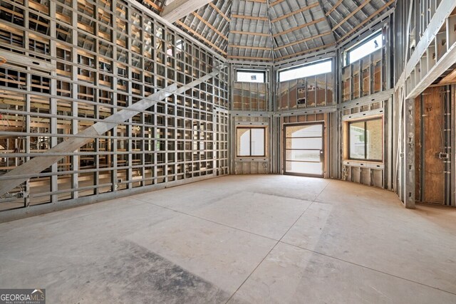 miscellaneous room featuring high vaulted ceiling