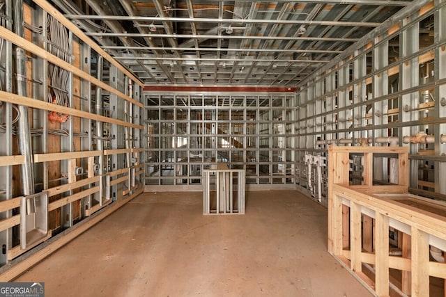 wine room featuring concrete flooring