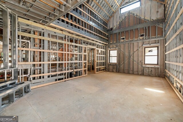 miscellaneous room with high vaulted ceiling