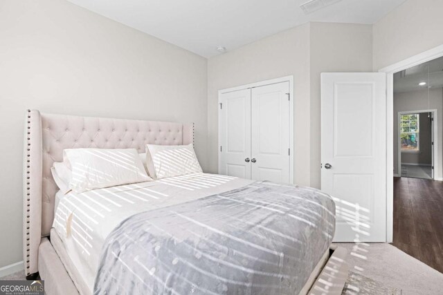 carpeted bedroom with a closet