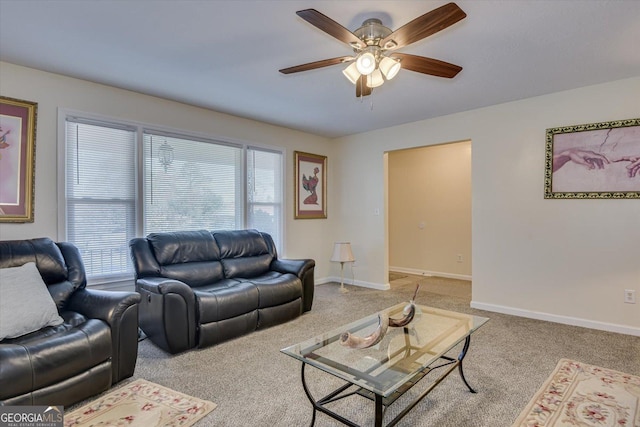 living room with carpet floors, ceiling fan, and a healthy amount of sunlight