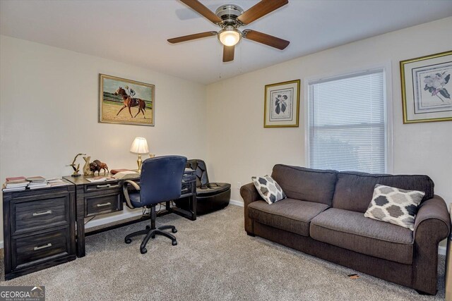 home office with light carpet and ceiling fan