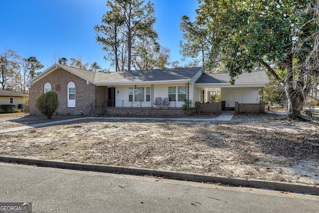 ranch-style home with covered porch