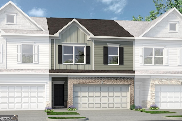 townhome / multi-family property featuring a garage