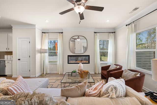 living room with light wood-type flooring and crown molding