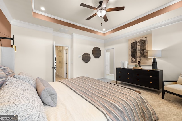 carpeted bedroom with a raised ceiling, ceiling fan, and crown molding