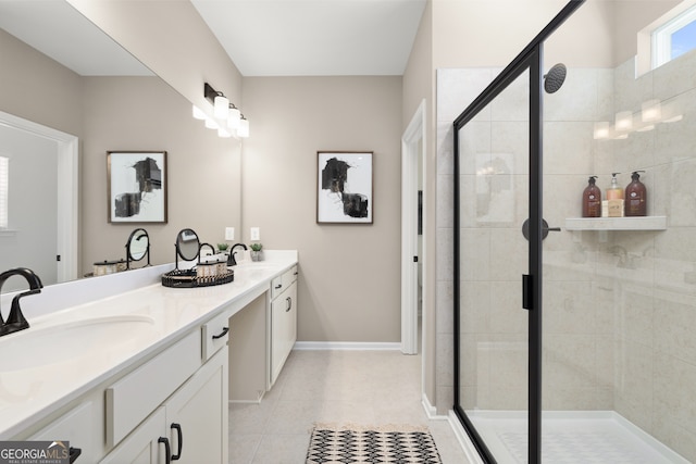 bathroom featuring tile patterned flooring, vanity, and a shower with shower door