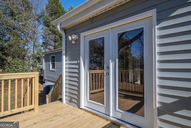 exterior space featuring french doors, a deck, and central AC unit