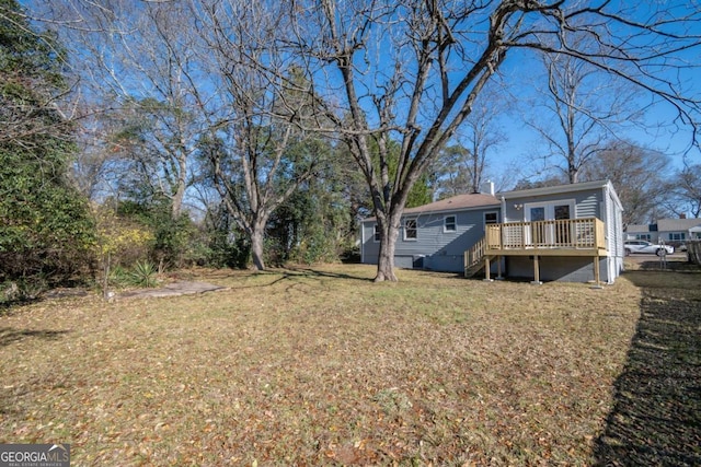 view of yard featuring a wooden deck