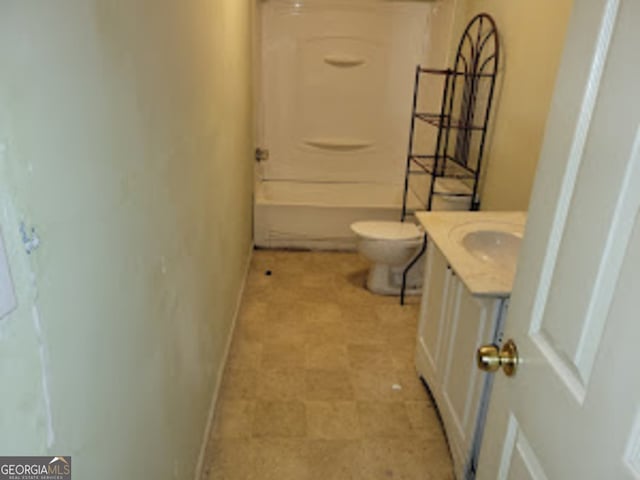 bathroom featuring toilet and vanity