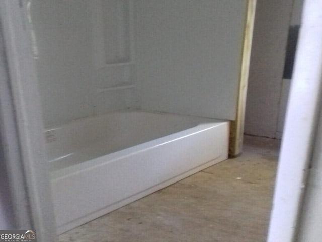 bathroom with a washtub