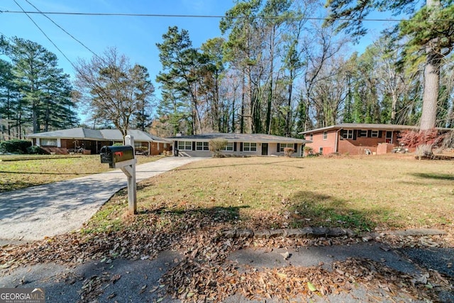 ranch-style house with a front yard