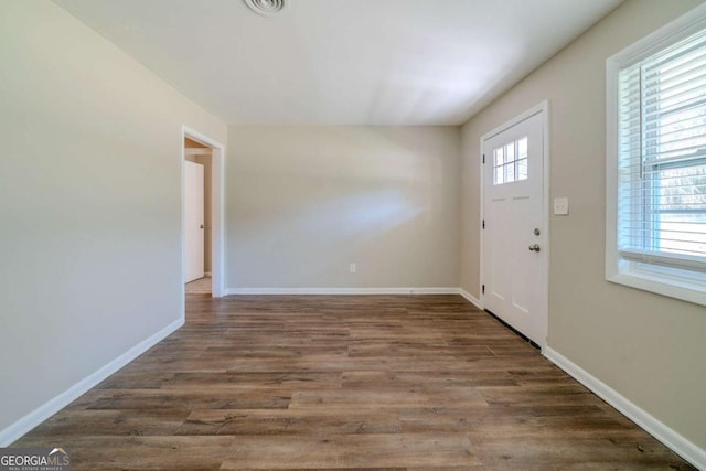 entryway with dark wood-type flooring