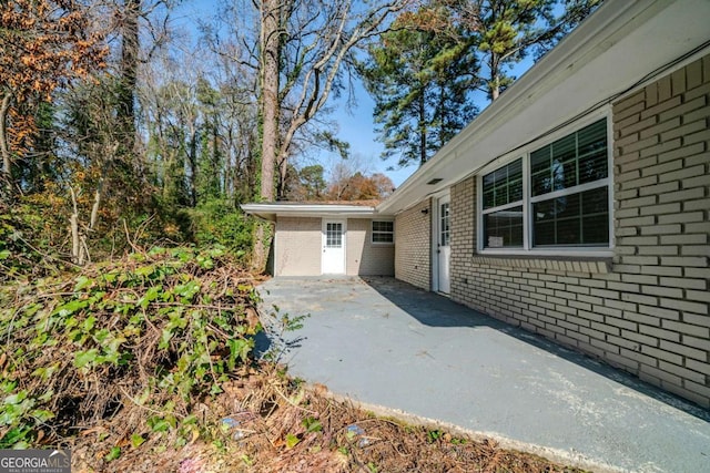 view of side of property featuring a patio