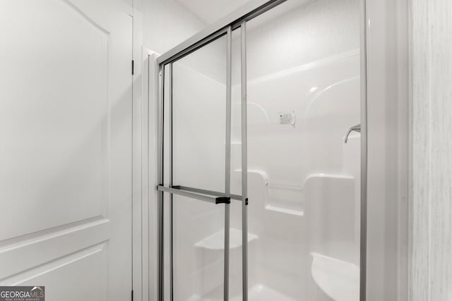 bathroom with an enclosed shower