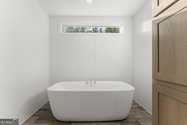 bathroom featuring a bathtub and hardwood / wood-style floors