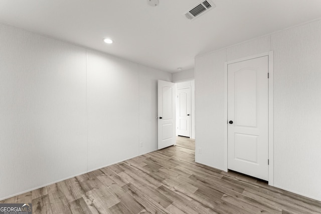 spare room featuring light hardwood / wood-style flooring