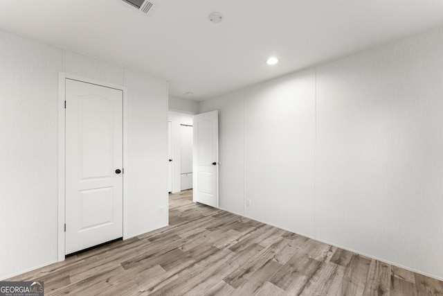 unfurnished bedroom with light hardwood / wood-style flooring