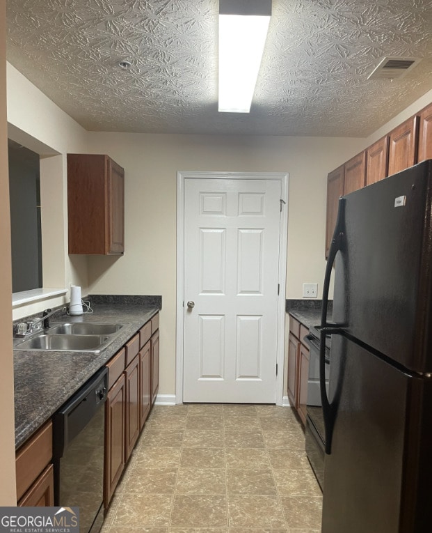 kitchen with sink and black appliances