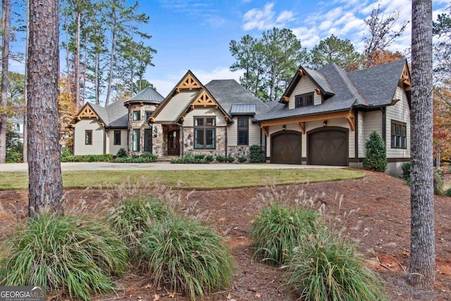 view of front of home with a garage and a front yard