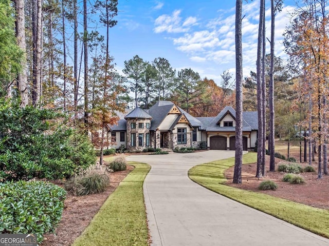 view of front facade featuring a garage and a front lawn