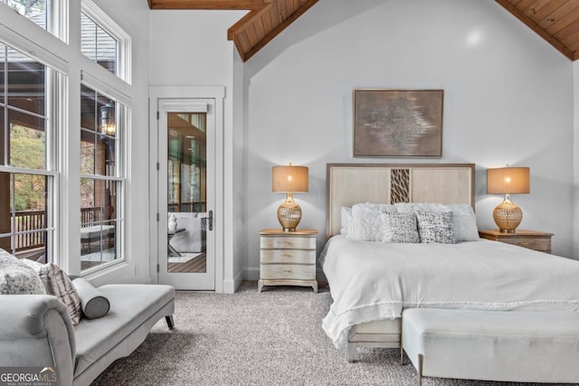 bedroom featuring carpet floors, high vaulted ceiling, and wood ceiling