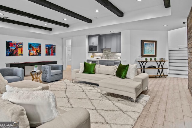 living room featuring beam ceiling