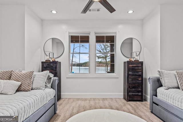 living room featuring light wood-type flooring, beverage cooler, and ceiling fan