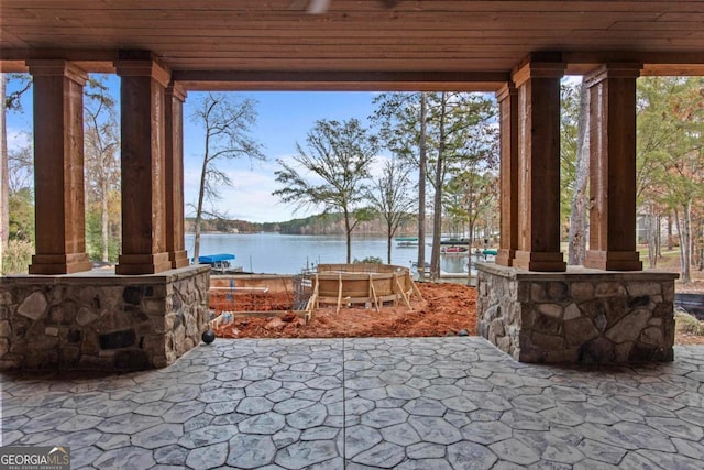 view of patio featuring a water view