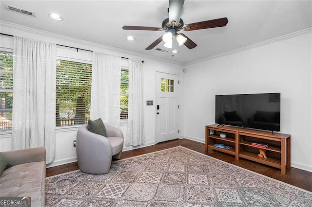 living room featuring wood-type flooring and ornamental molding