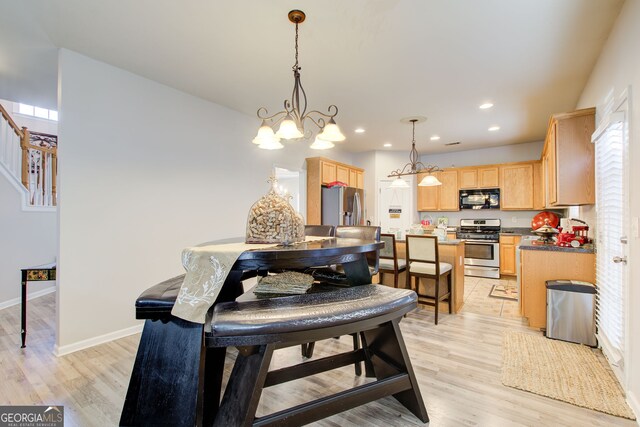 dining area featuring recessed lighting, stairway, baseboards, and light wood-style floors
