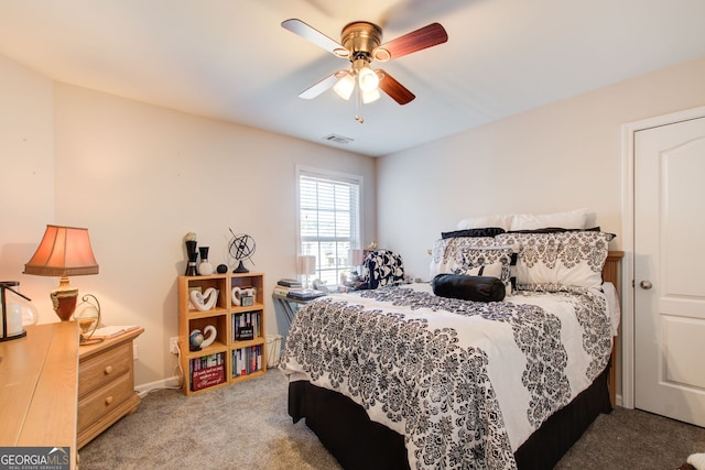 carpeted bedroom featuring visible vents and ceiling fan