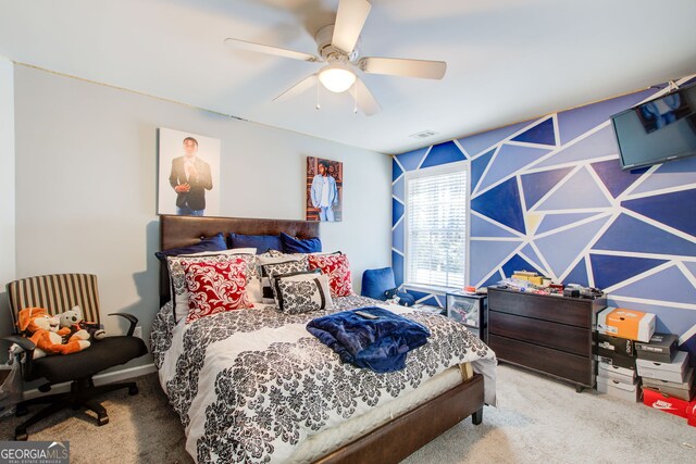 bedroom featuring a ceiling fan and carpet